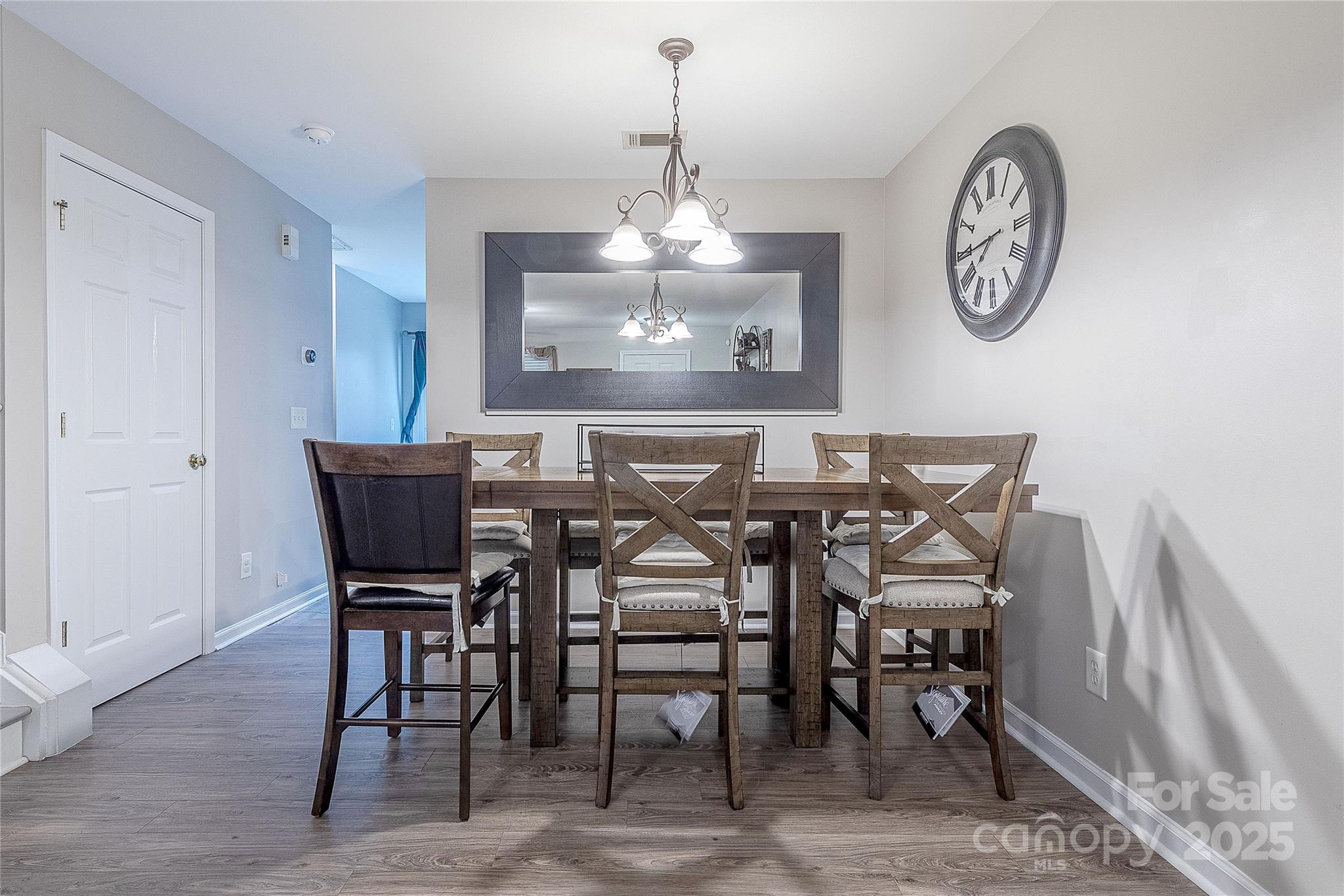 1581 Maypine Commons Way Rock Hill, SC 29732 - Photo 4 of 16 a view of a dining room with furniture and a chandelier