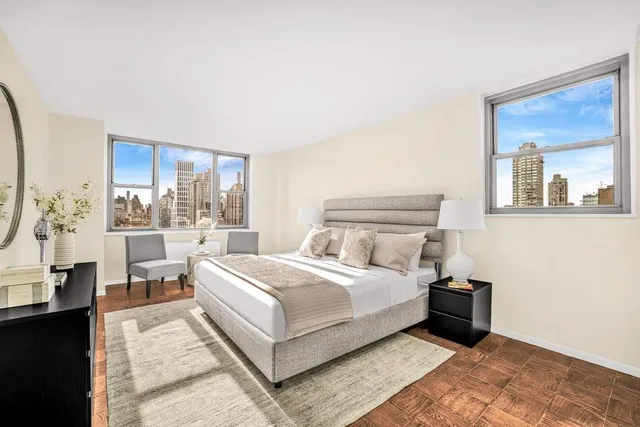 a kitchen with a stove and a white wooden cabinets