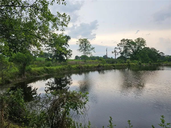 a view of lake with green space