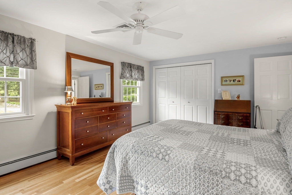 13 Spring Street Danvers, MA 01923 - Photo 20 of 39 a bedroom with a bed and a dresser