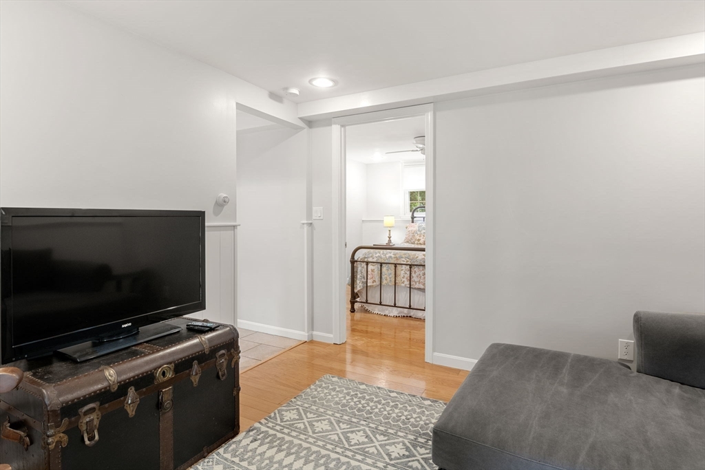 13 Spring Street Danvers, MA 01923 - Photo 28 of 39 a living room with furniture and a flat screen tv