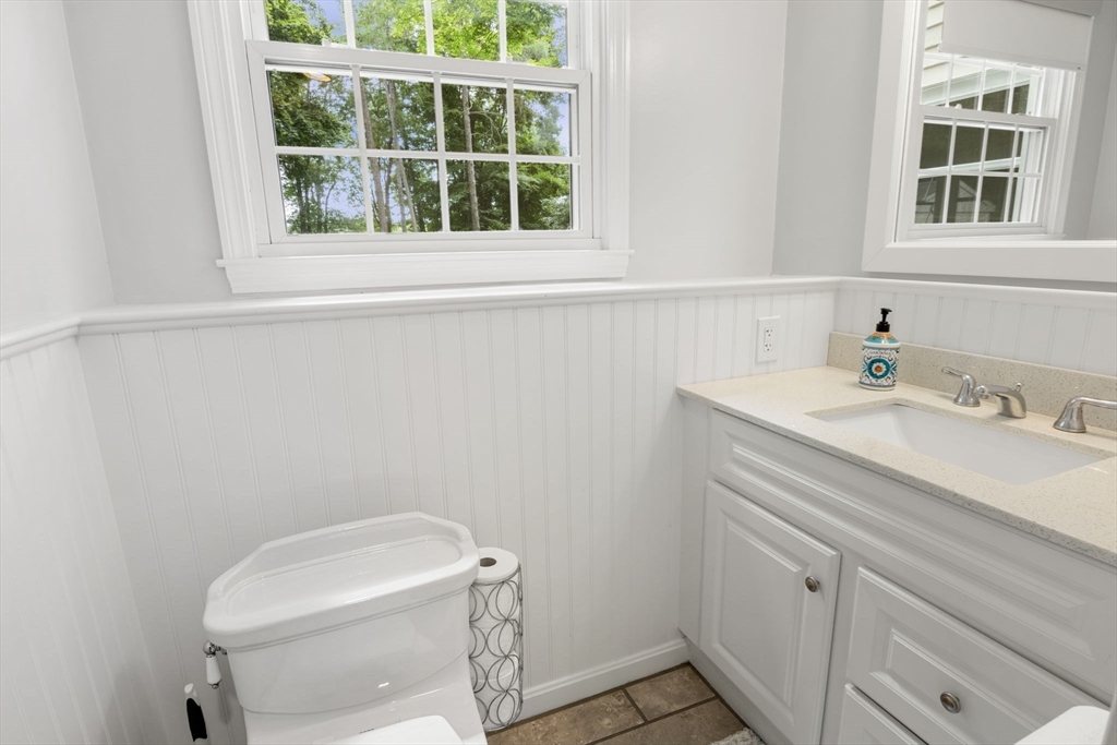 13 Spring Street Danvers, MA 01923 - Photo 29 of 39 a bathroom with a sink a toilet and a window