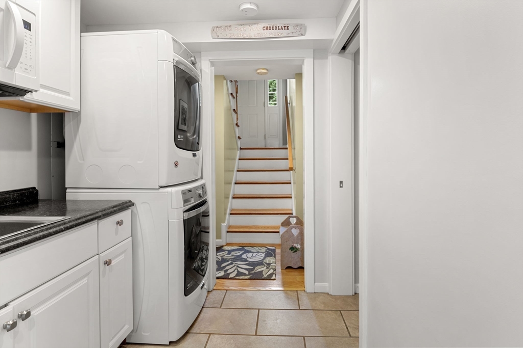 13 Spring Street Danvers, MA 01923 - Photo 32 of 39 a kitchen with a sink and cabinets