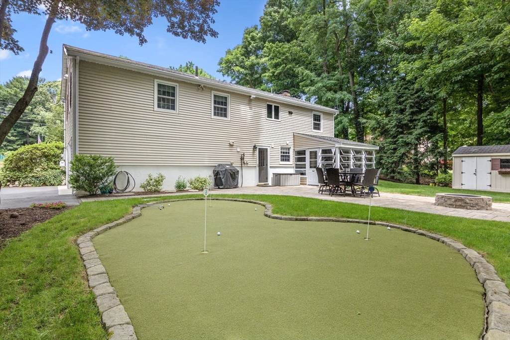 13 Spring Street Danvers, MA 01923 - Photo 4 of 39 a view of a house with swimming pool and a chairs