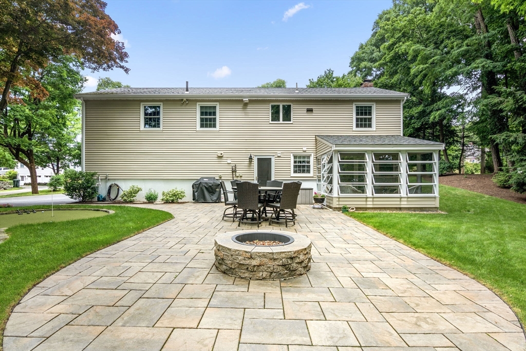 13 Spring Street Danvers, MA 01923 - Photo 6 of 39 a view of a house with backyard sitting area and garden