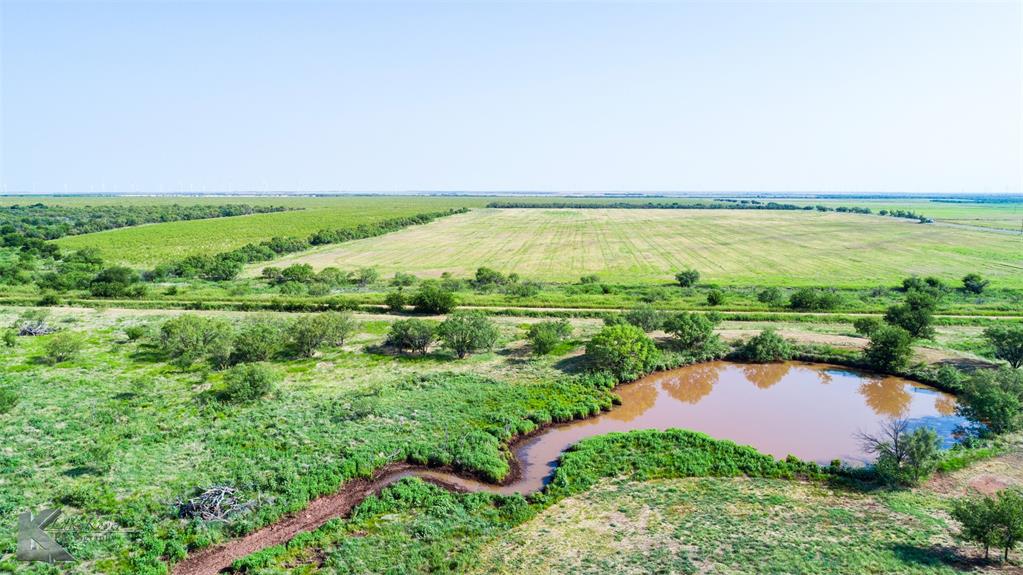 8244 Farm To Market 266 Haskell, TX 79521 - Photo 12 of 40 Aerial view of property's location featuring a nearby body of water, rural landscape, and rows of crops