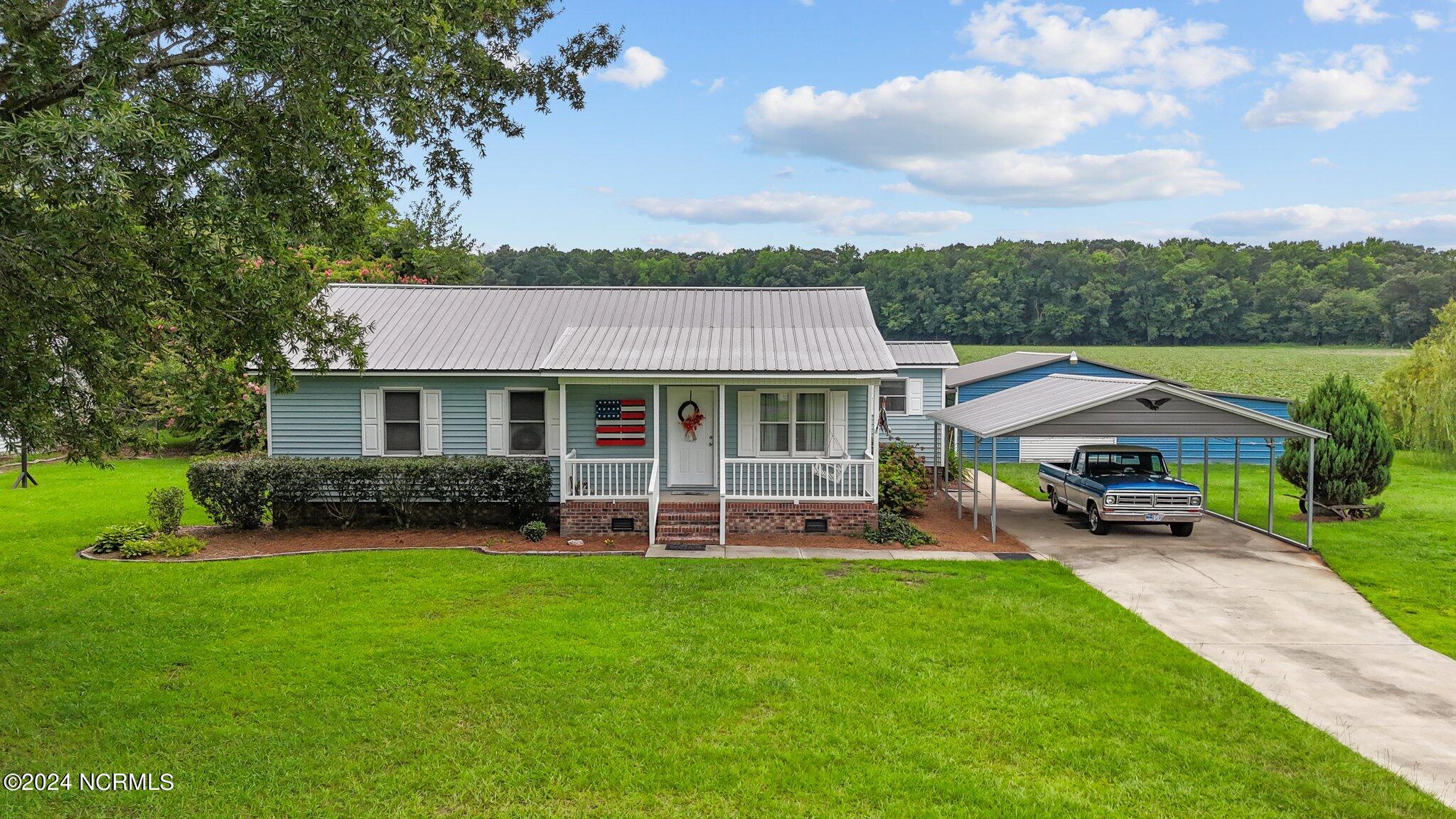 3398 Alvin Road Grimesland, NC 27837 - Photo 3 of 52 3-web-or-mls-DJI_20240729134654_0700_D