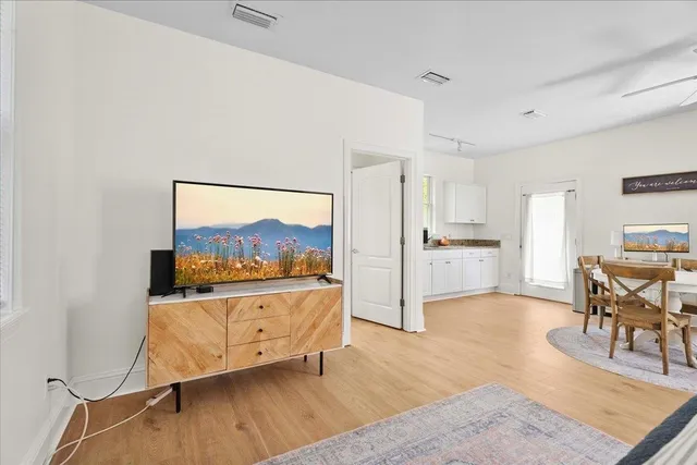 a front view of a house with garden and porch