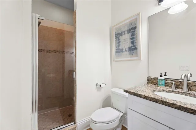 an aerial view of a house with a garden and swimming pool