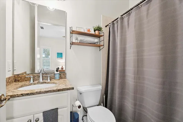 an aerial view of a house with an outdoor space