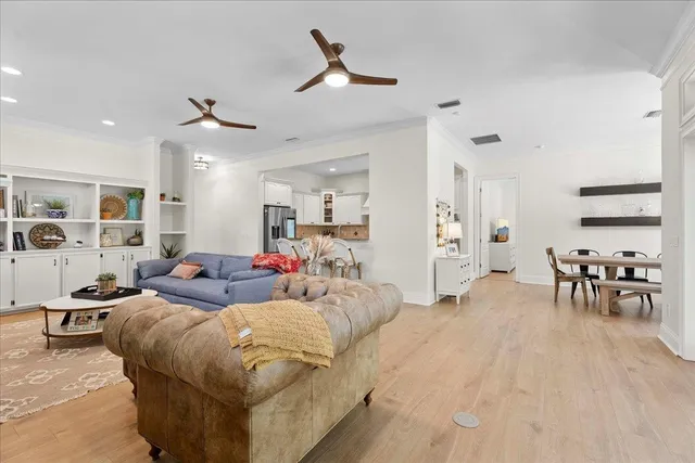 a kitchen with granite countertop a sink a stove and cabinets