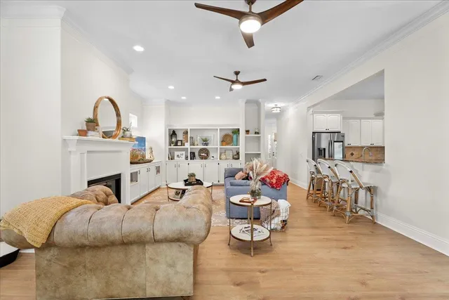 a large kitchen with stainless steel appliances sink a microwave and cabinets