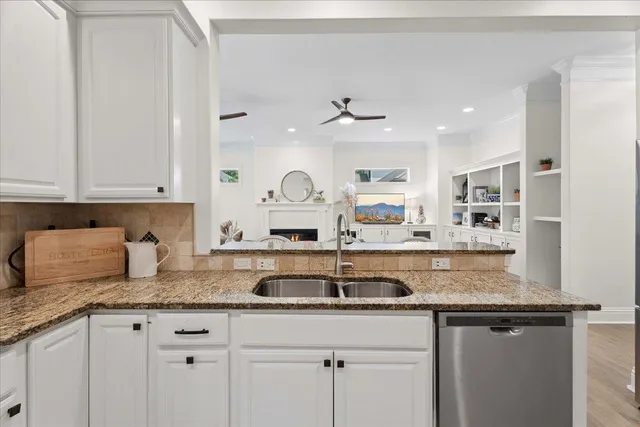 a living room with fireplace furniture and a flat screen tv