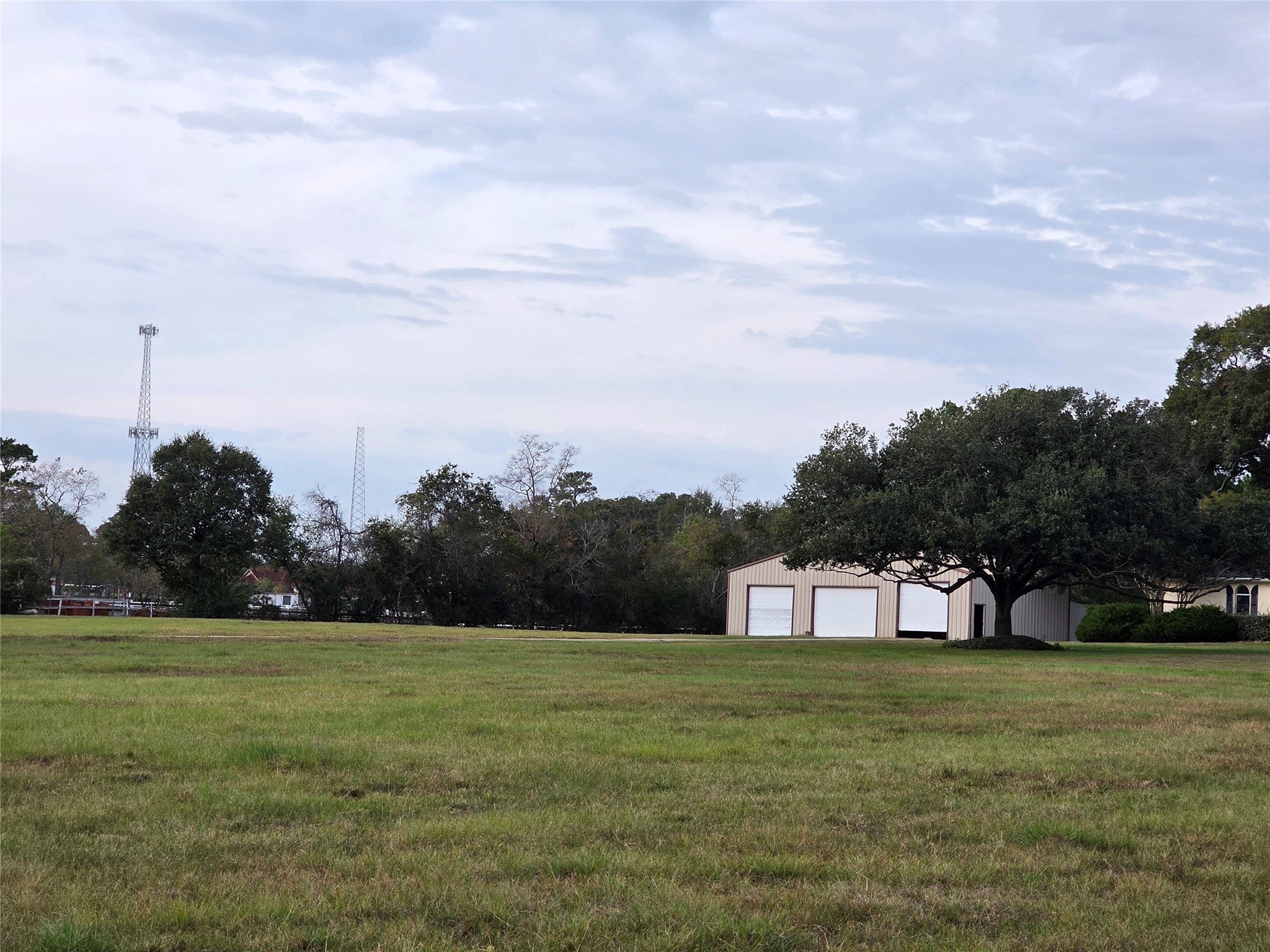 27303 Decker Prairie-Rosehill Road Magnolia, TX 77355 - Photo 3 of 9 a view of a green field