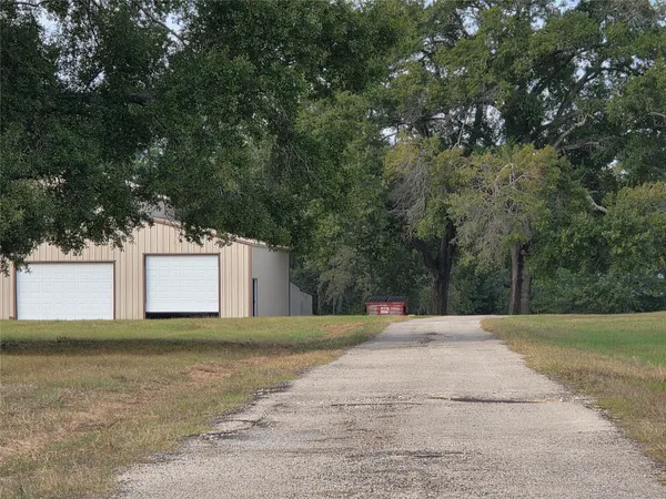 a view of a field with sitting area