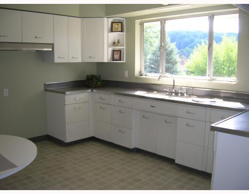 407 Soose Road Pittsburgh, PA 15209 - Photo 5 of 13 Kitchen. The spacious kitchen features lots of cabinets, new kitchen floor, and a wonderful large window letting the sun shine in!