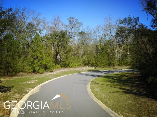 a view of a swimming pool with an trees