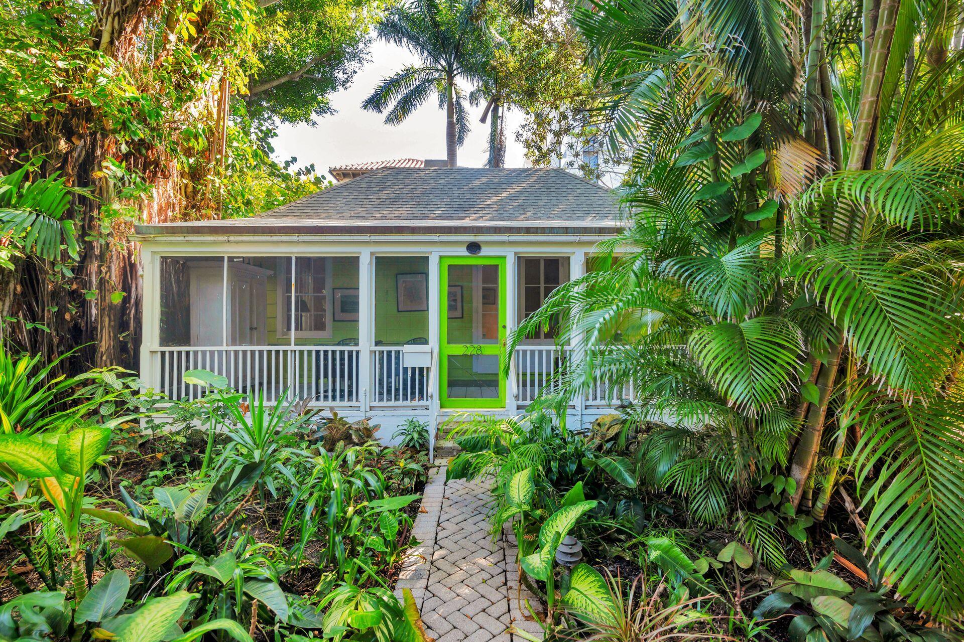 228 Phipps Plaza Palm Beach, FL 33480 - Photo 16 of 24 a view of a yard in front of a house with a large tree