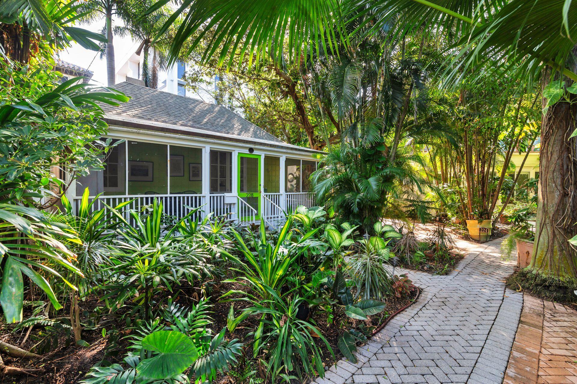 228 Phipps Plaza Palm Beach, FL 33480 - Photo 18 of 24 a view of a house with a flower garden