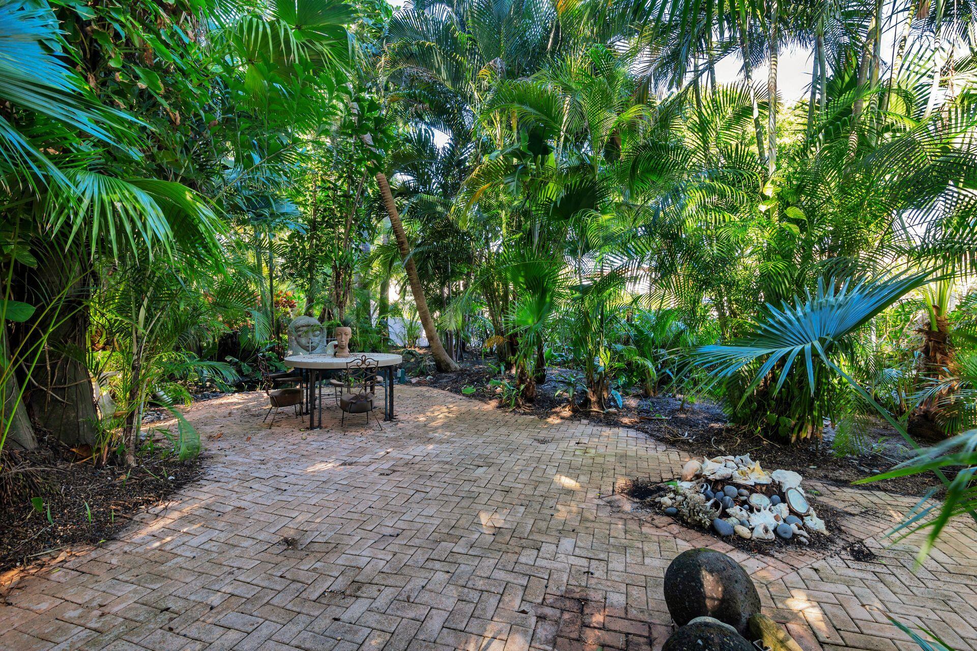 228 Phipps Plaza Palm Beach, FL 33480 - Photo 21 of 24 a view of a backyard with sitting area