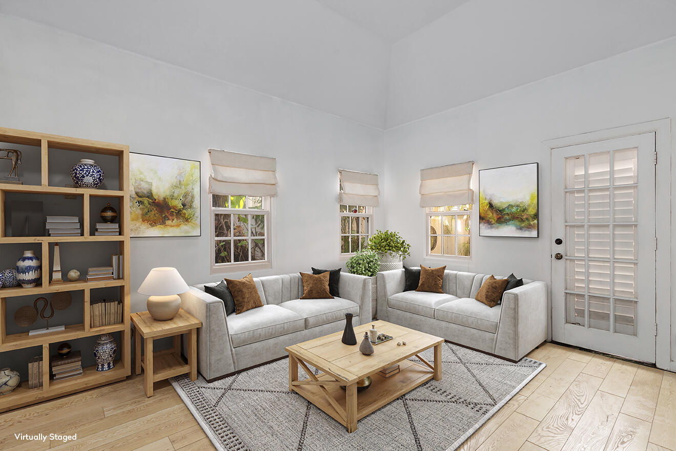 228 Phipps Plaza Palm Beach, FL 33480 - Photo 4 of 24 a living room with furniture a rug and a table