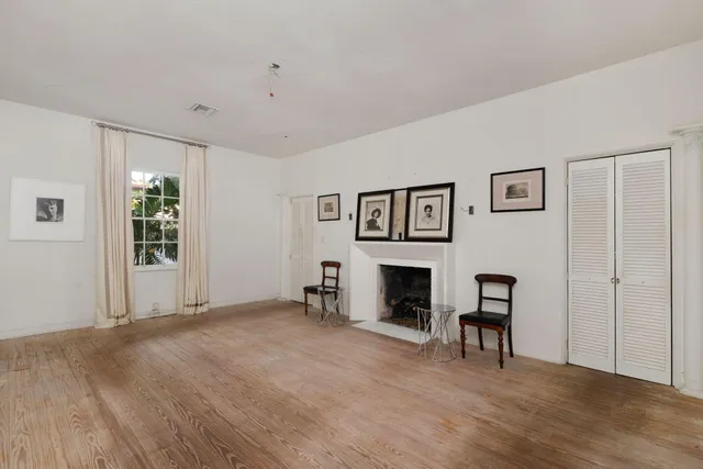 a view of livingroom with hardwood floor and a fireplace