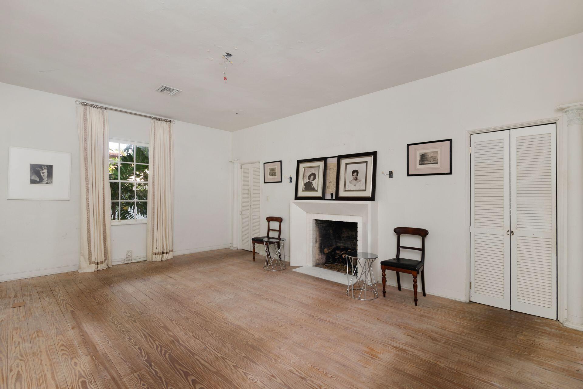 228 Phipps Plaza Palm Beach, FL 33480 - Photo 6 of 24 a view of livingroom with hardwood floor and a fireplace