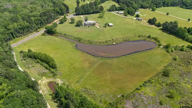 a view of a lake with a big yard