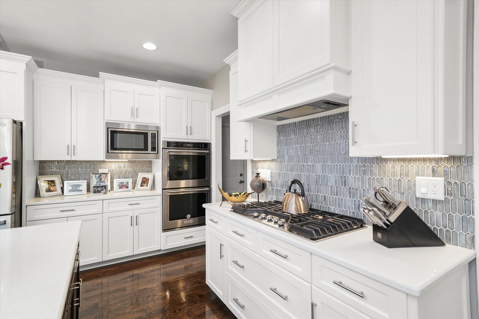8613 High Stone Way Frankfort, IL 60423 - Photo 14 of 53 a kitchen with stainless steel appliances a stove microwave and cabinets