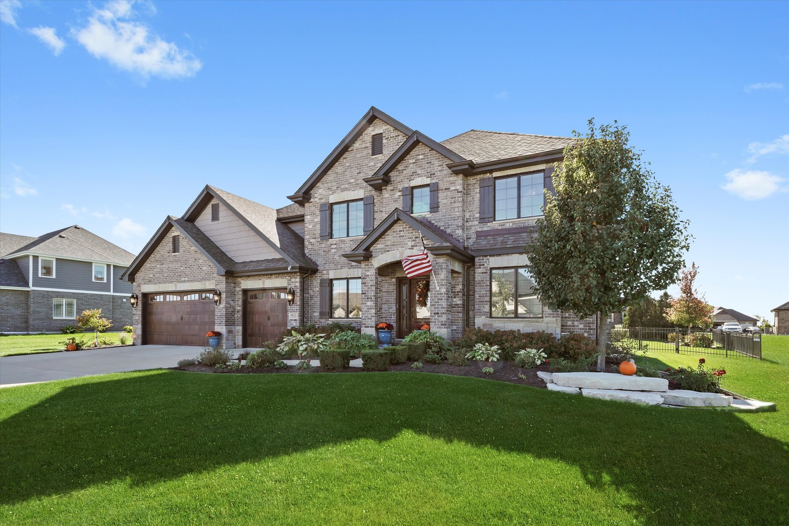 8613 High Stone Way Frankfort, IL 60423 - Photo 2 of 53 a front view of a house with a yard and trees