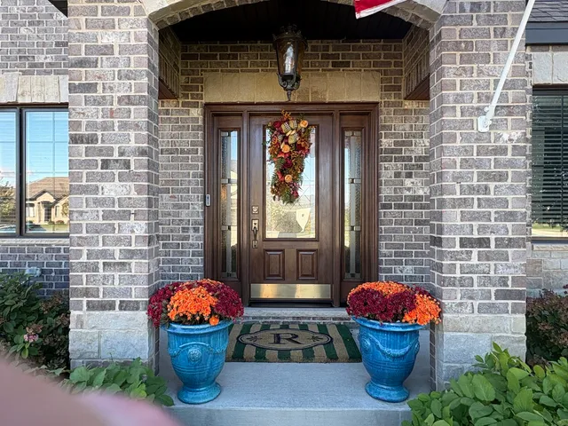 a front view of a house with outdoor seating