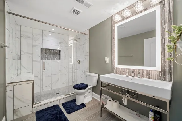 a living room with patio furniture and a large window