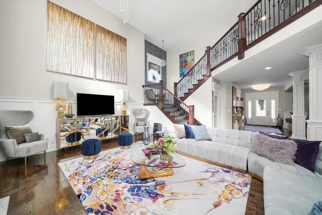 a view of a livingroom with furniture and a flat screen tv