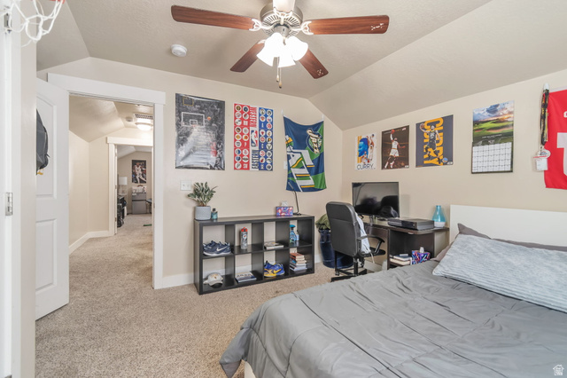 13038 Tower Ridge Drive Riverton, UT 84096 - Photo 29 of 30 Carpeted room with a vaulted ceiling, ceiling fan, and white trim