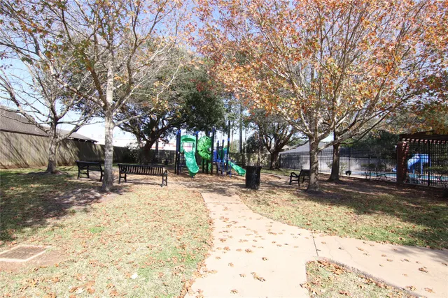 a view of a yard with a tree