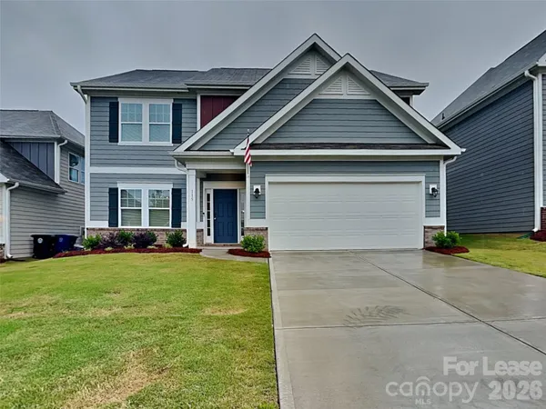 a front view of a house with swimming pool