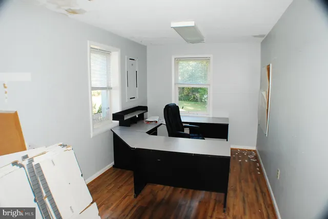 a workspace with furniture and window