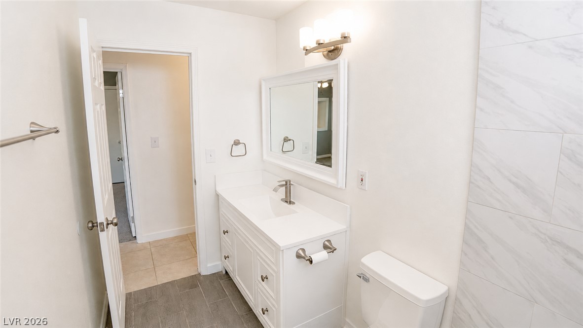 2870 South Sandhill Road Las Vegas, NV 89121 - Photo 37 of 64 A well-appointed bath features a sleek vanity, modern fixtures, and ample lighting.