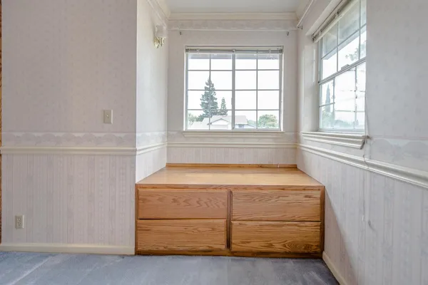 a room with storage and window