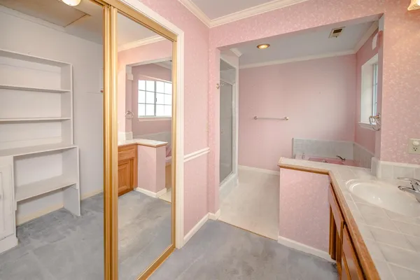 a bathroom with a sink and mirror