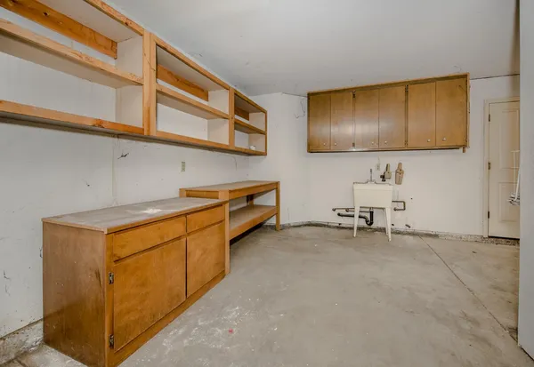 a kitchen with stainless steel appliances granite countertop a sink and a cabinets