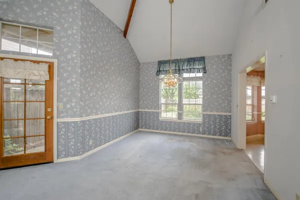 a view of an empty room with a window
