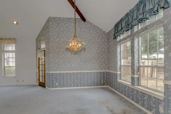 an empty room with windows