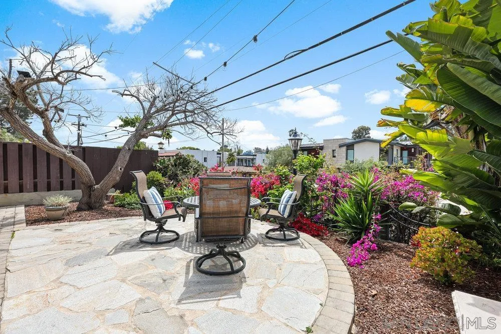 720 Valley Avenue Solana Beach, CA 92075 - Photo 10 of 12 a outdoor dining space with furniture and flowers