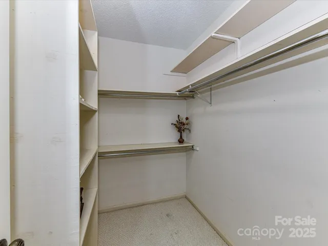 a room with bed and a window