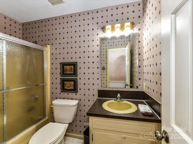 a view of a livingroom with furniture and a window