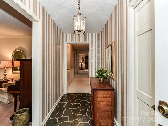 a view of a hallway view with staircase