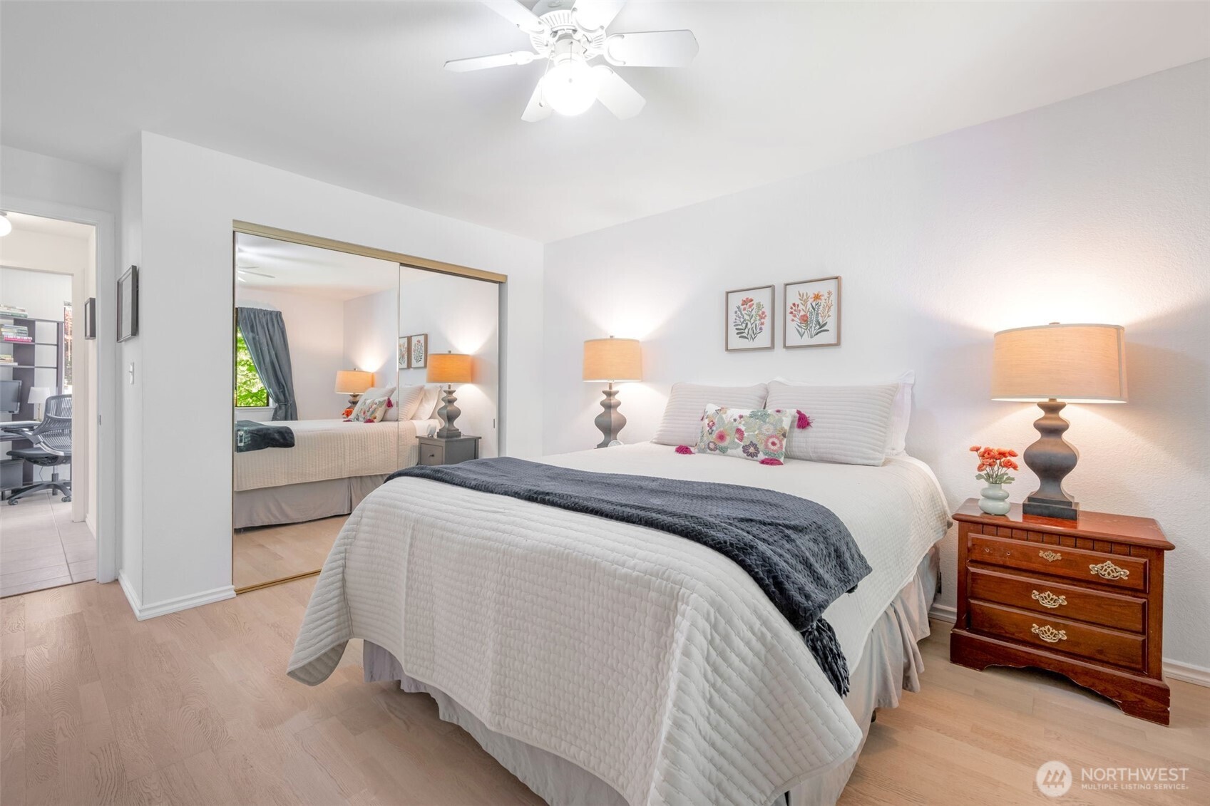 8017 196th Street Southwest, Unit 6B Edmonds, WA 98026 - Photo 14 of 23 a bedroom with a bed and a chandelier