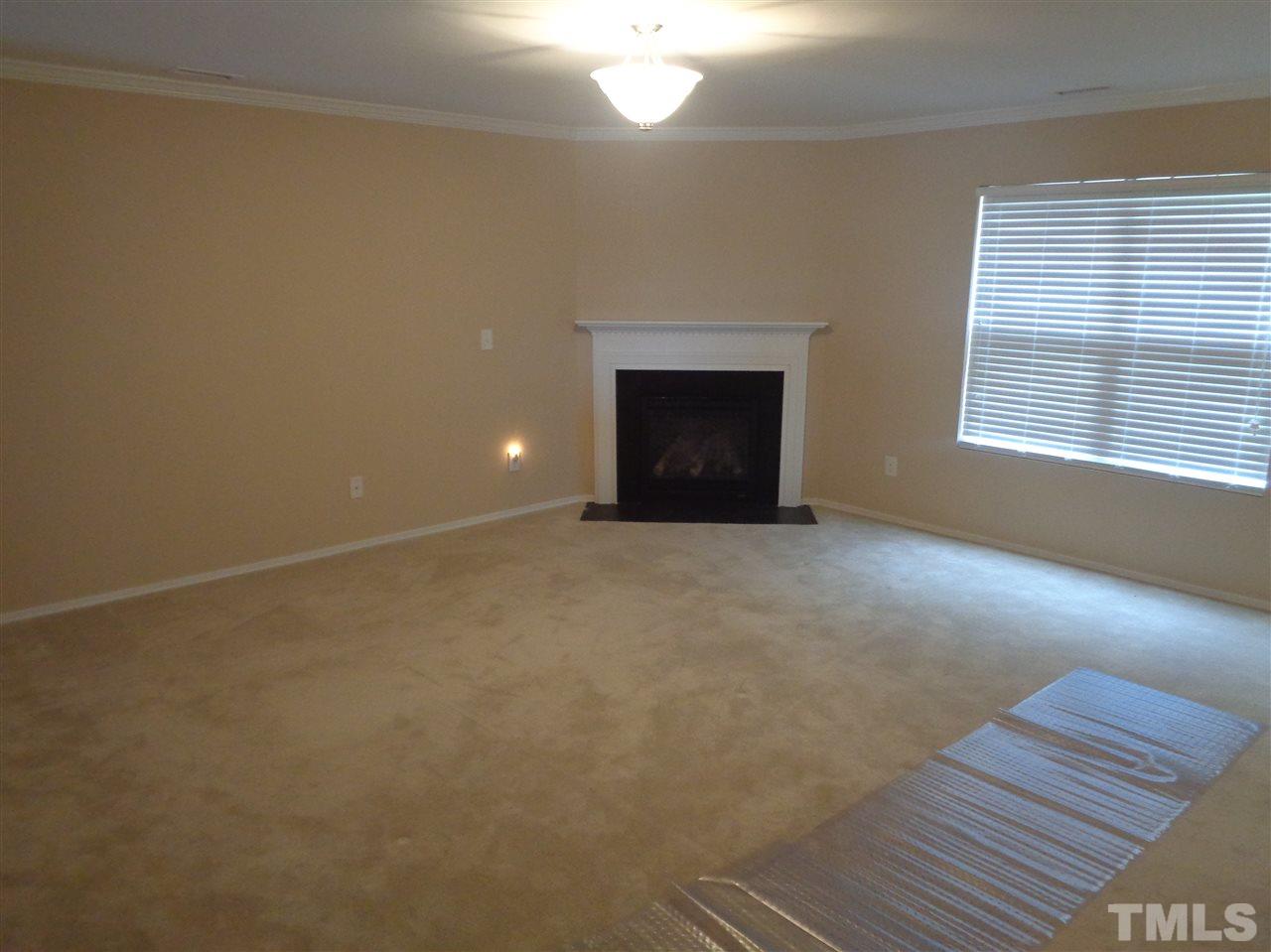 3033 Varcroft Road Knightdale, NC 27545 - Photo 3 of 16 a view of an empty room with a window