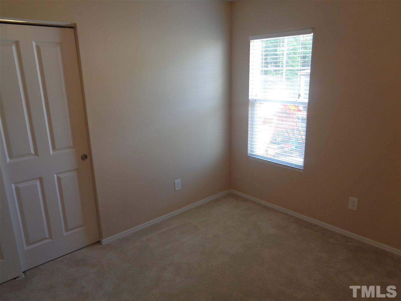 3033 Varcroft Road Knightdale, NC 27545 - Photo 5 of 16 an empty room with windows